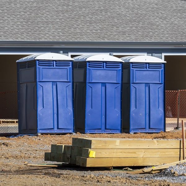 what is the cost difference between standard and deluxe porta potty rentals in Tom Bean